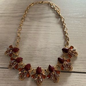Women’s short gold necklace with Ruby stones